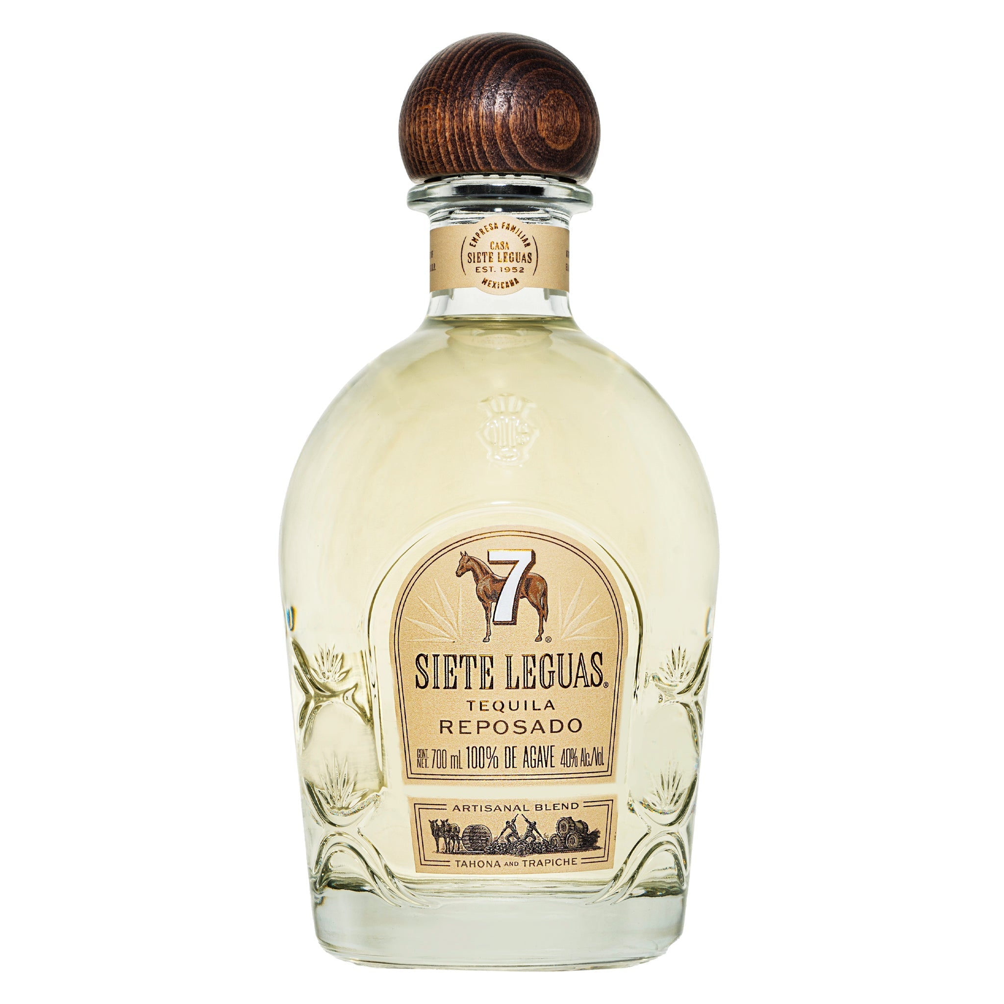 A glass bottle of Siete Leguas Reposado features a wooden cap, a beige label with a horse and the number 7, and holds light golden tequila.