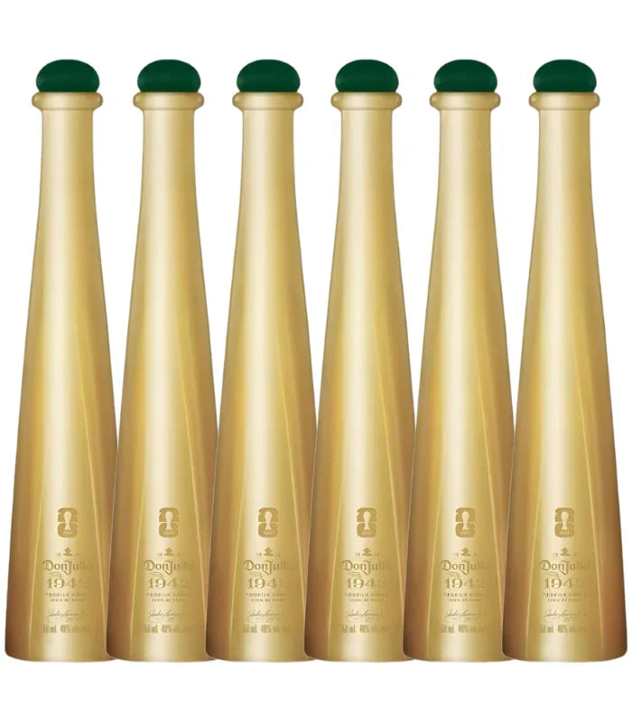 Six gold-colored bottles with green tops are lined up, each labeled Don Julio 1942 FIFA World Cup 2026 Limited Edition 50mL by Don Julio, featuring embossed details on the front.