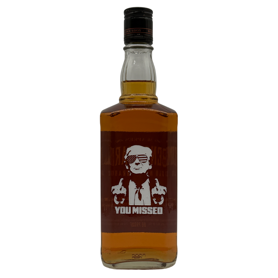 The Benchmark Old No. 8 "You Missed" Limited Edition 750mL features a label with a cartoon in sunglasses and a suit showing both middle fingers, plus the phrase “YOU MISSED.” A must-have collectible for whiskey enthusiasts.