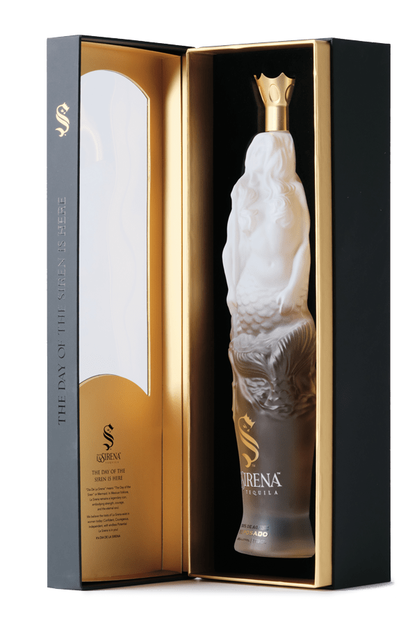 Día De La Sirena Reposado Tequila presented in a frosted glass mermaid-shaped bottle inside a luxurious gift box.