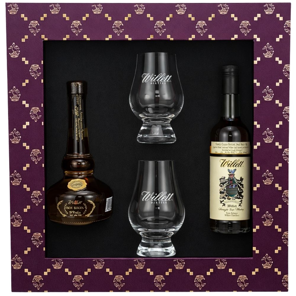 The Willett Family Estate 50ml Gift Pack includes two bottles of Willett whiskey and two Willet Glencairn glasses, all elegantly presented in a purple box with gold patterns.
