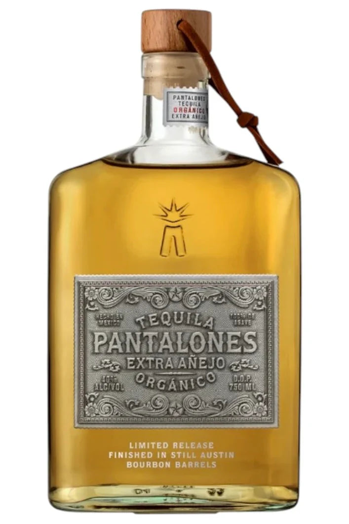 Pantalones Organic Extra Añejo Tequila is a limited release with a wooden cap, silver label, and gold liquid. Finished in bourbon barrels, this organic tequila delivers a rich, distinctive taste.