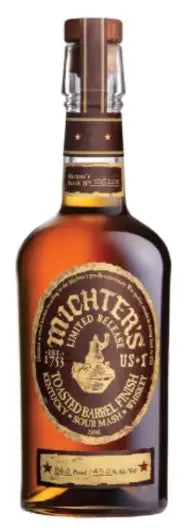 A bottle of Michter's Toasted Barrel Finish Sour Mash Kentucky Straight Whiskey 2025 Limited Edition, a rare American whiskey by Michter's, with a brown and gold label and wax-sealed cap.