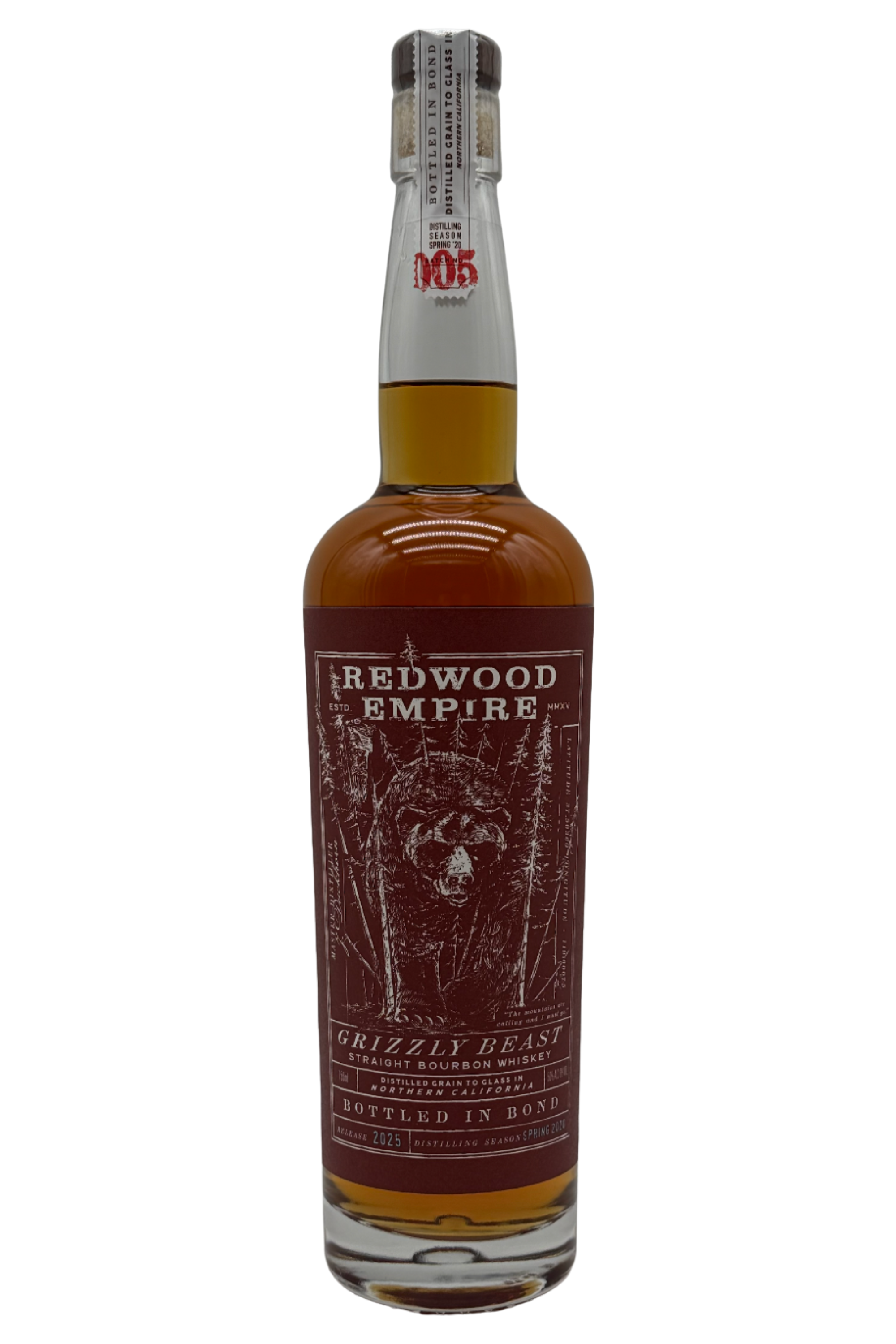 Redwood Empire Grizzly Beast Bottled in Bond Straight Bourbon Whiskey Batch 005 (2025 Release) from Redwood Empire Whiskey features a brown label with forest and bear imagery, plus a clear glass neck and sealed cork top.