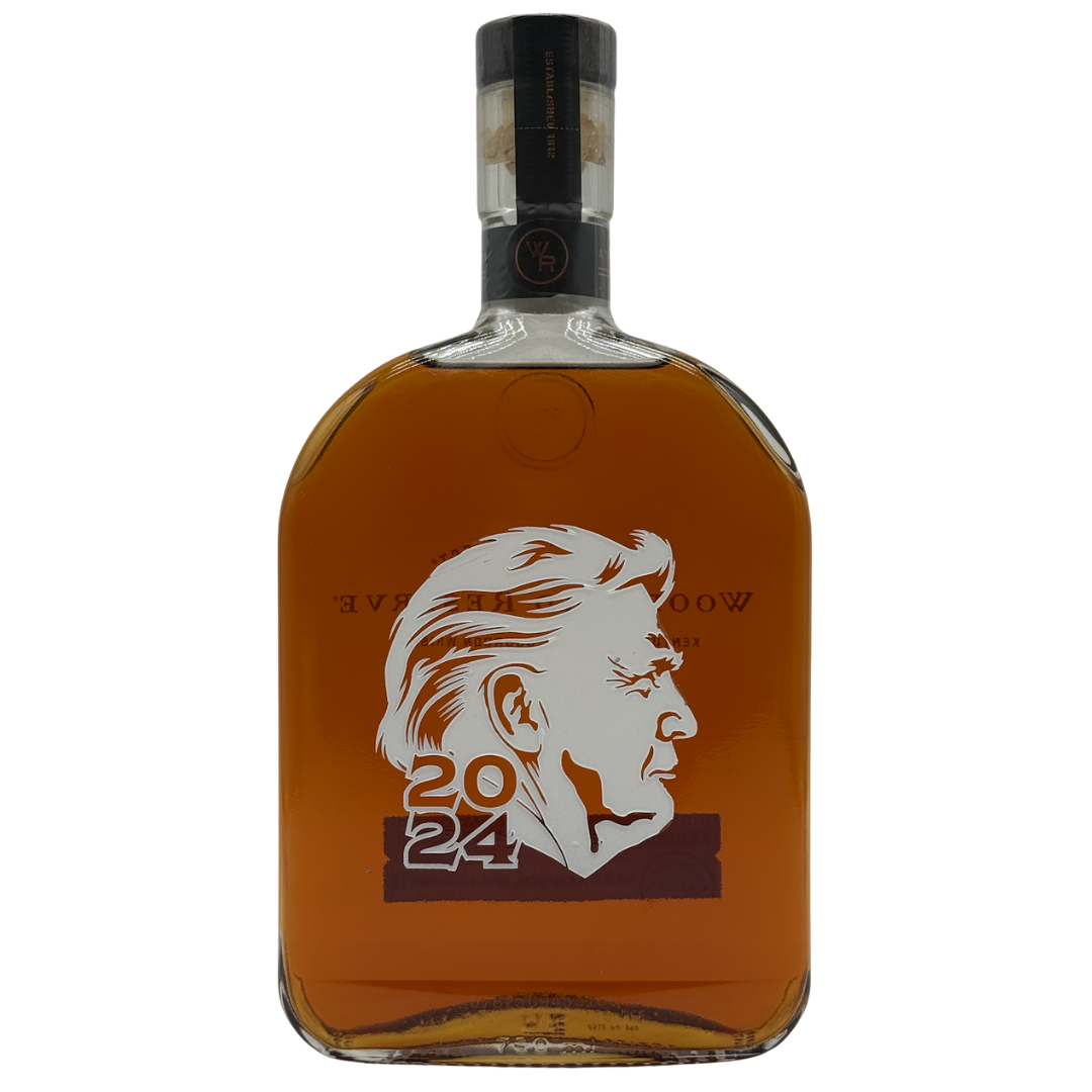 The Woodford Reserve Kentucky Straight Bourbon "Presidential 2024" Limited Edition features a white silhouette of a man's side profile and 2024 on the front, filled with amber bourbon and sealed with a black cap.