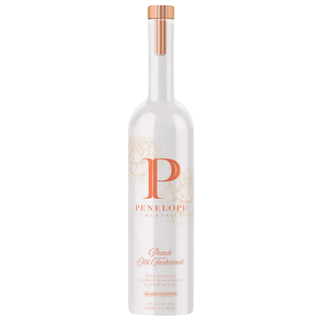 A tall white bottle with floral accents, a copper-toned cap, and elegant script displays Penelope Peach Old Fashioned by Penelope Bourbon—a ready-to-pour cocktail capturing the essence of their bourbon.