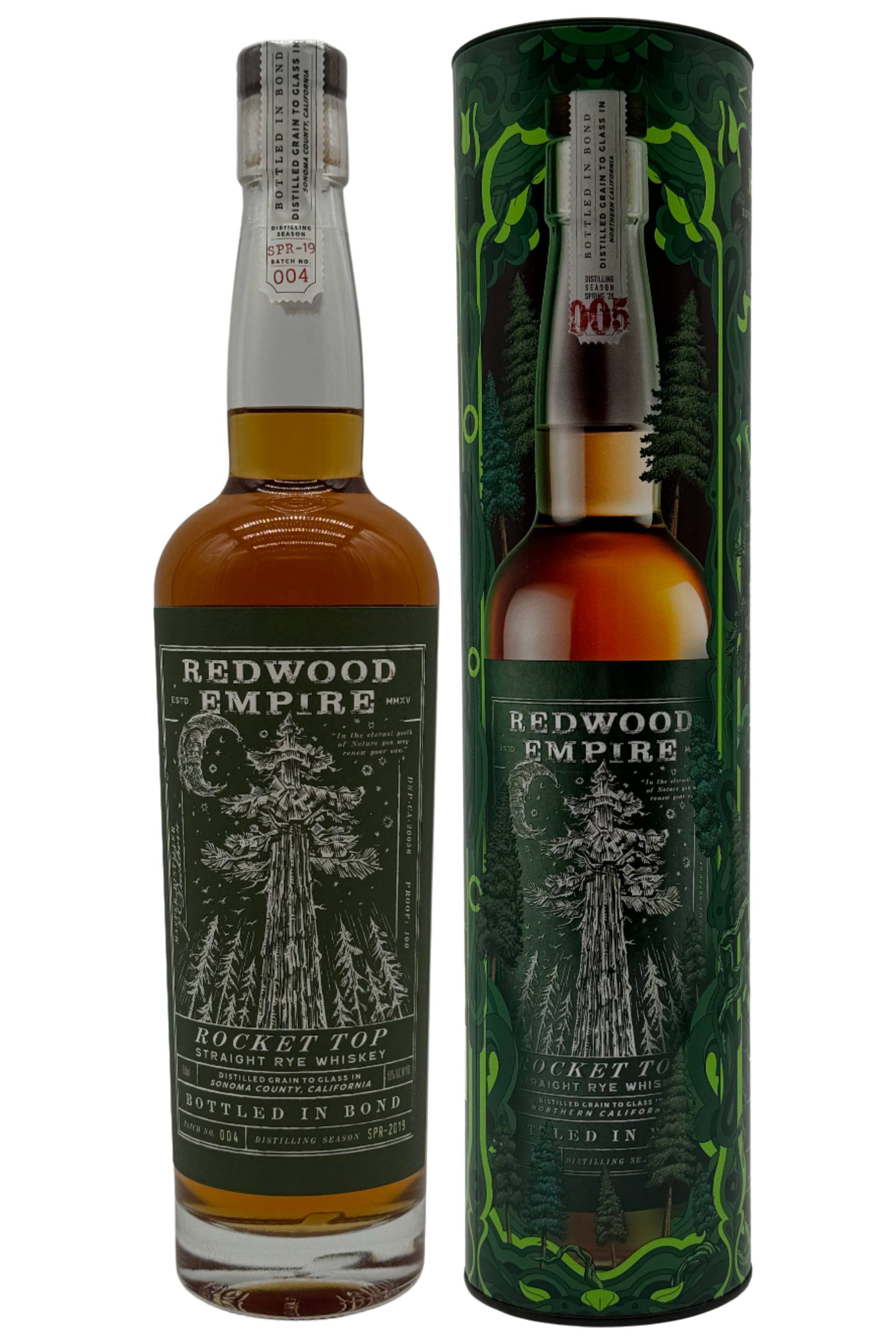 A bottle of Redwood Empire Rocket Top Bottled in Bond Straight Rye Whiskey Batch 004 2025 Release by Redwood Empire Whiskey stands beside its matching green cylinder, both adorned with a redwood tree and forest-inspired Sonoma County design.