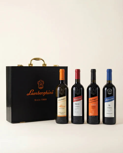 The Lamborghini Ultimate Wine Gift Set—Trescone, Era, Taurus, and Alice—by Lamborghini Wine & Spirits Collections features four labeled bottles and a luxury black gift case with gold accents, perfect for any elegant wine gifting occasion.